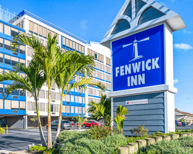 Fenwick Inn Sign with building in the background